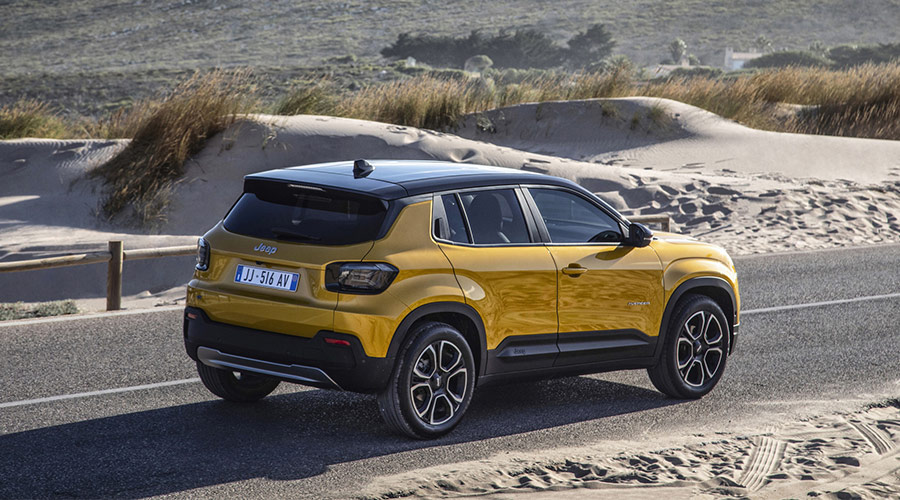 Yellow Jeep Avenger parked on a desert reaod