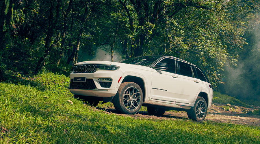 Black Grand Cherokee parked oustide of house