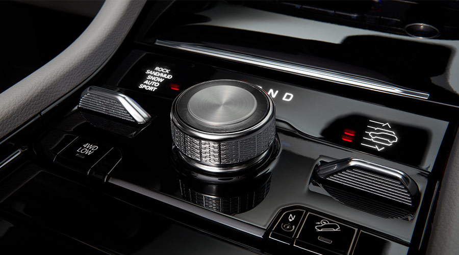 Black Grand Cherokee parked oustide of house