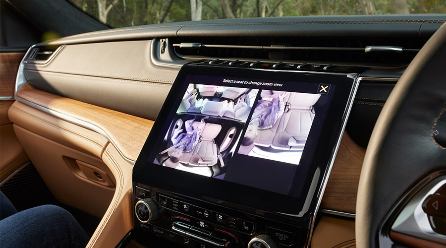 Grand Cherokee driving along highway at sunset