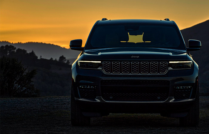 Front of the Grand Cherokee in black at sunset